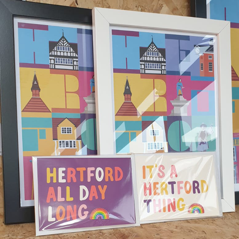 Hannah Bailey Hertford All Day Long purple postcard and enamel pin badge displayed