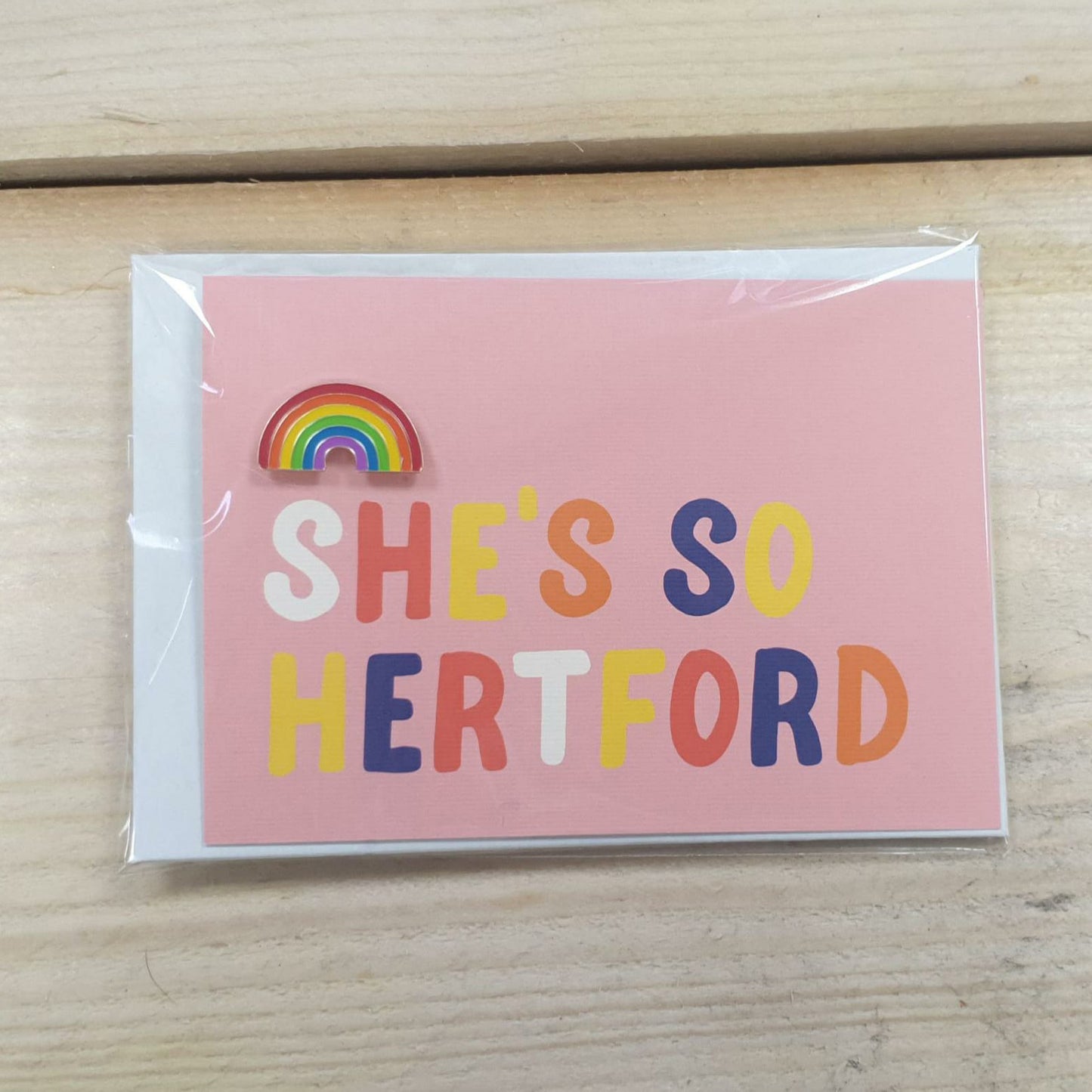 Hannah Bailey She's So Hertford pink postcard and enamel pin badge